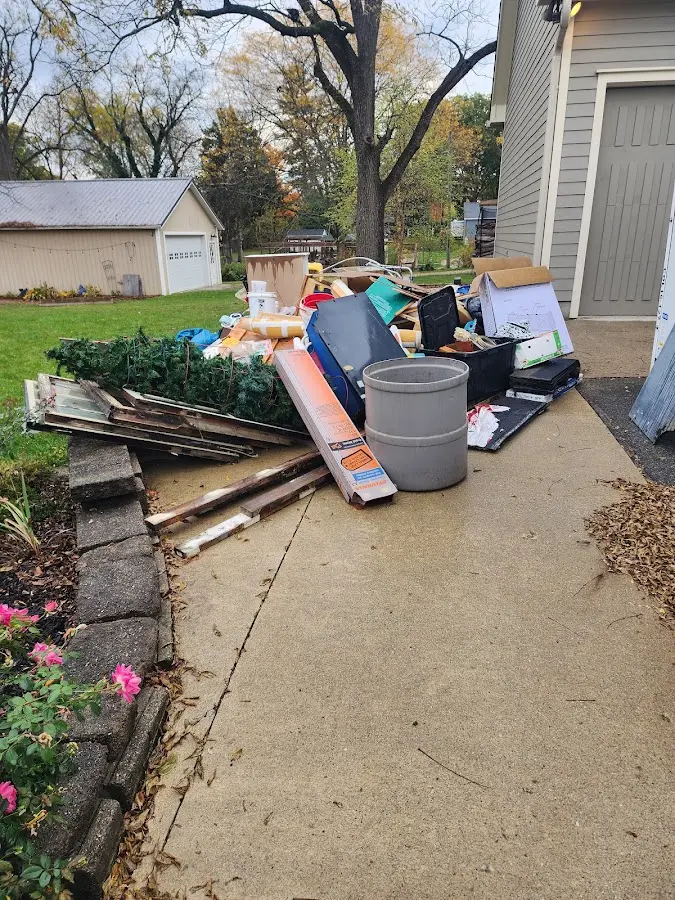 Dumpster being loaded with debris for 30 Yard Dumpster Rental in Magnolia